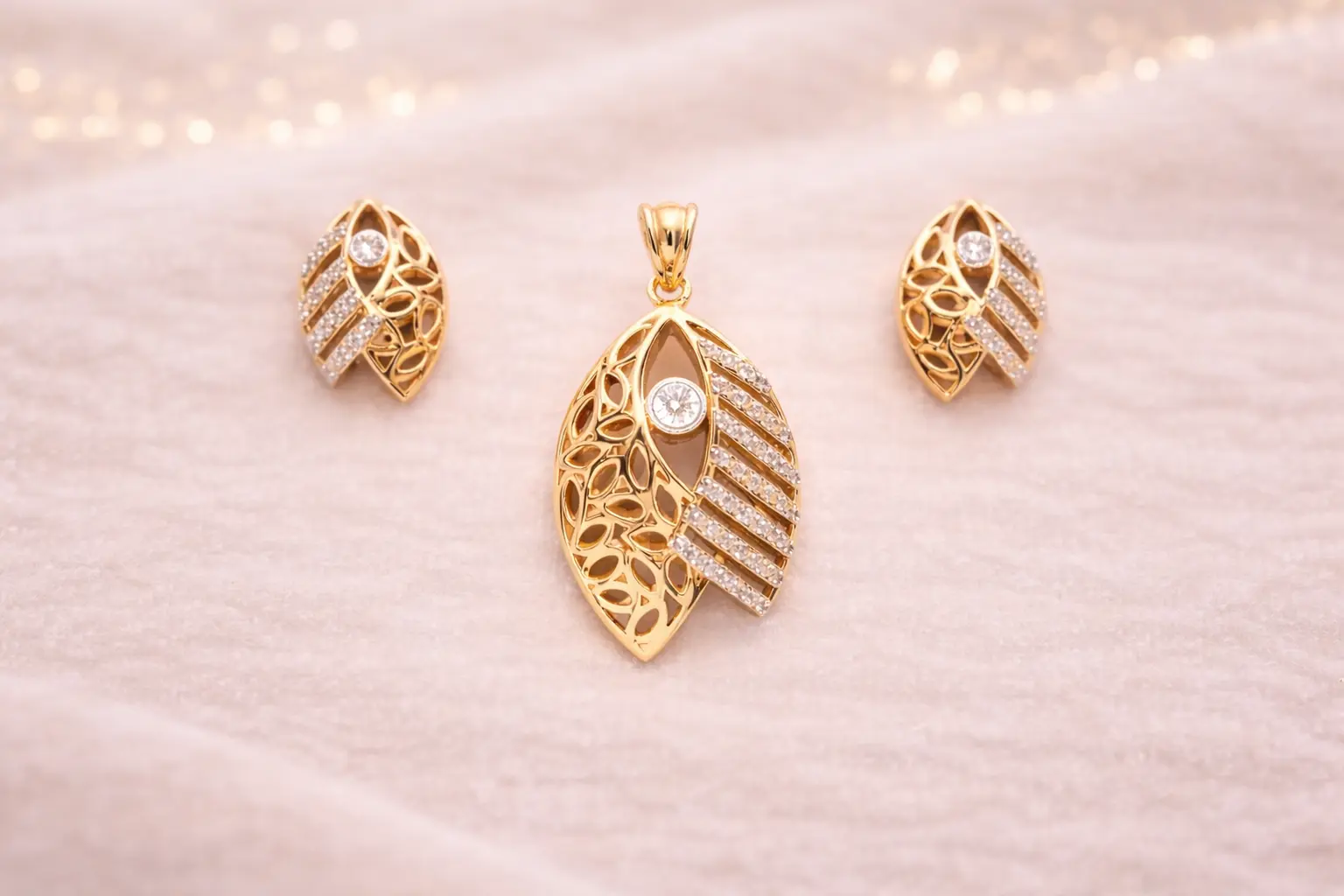 Gold earrings with gemstones displayed on a stand